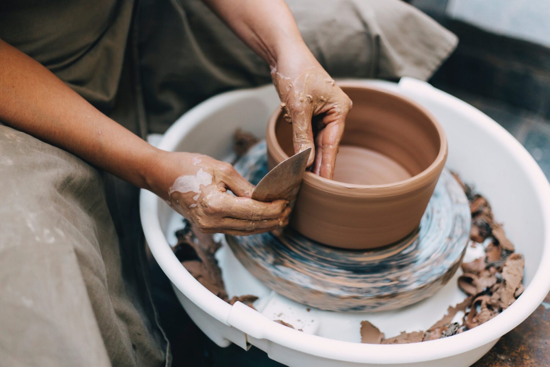 Brown Clay Pot Being Sculpted